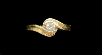 Lot 1168 - A 9ct yellow gold diamond set solitaire ring,...