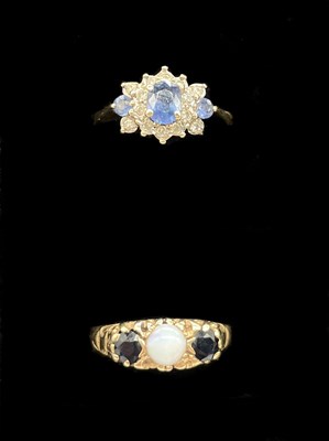 Lot 1169 - A 9ct yellow gold opal and sapphire ring in...