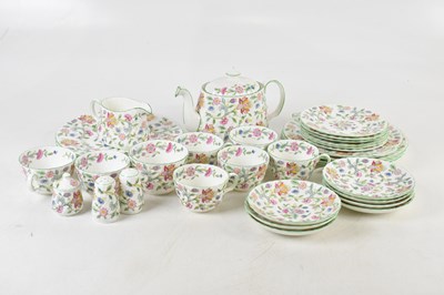 Lot 702 - MINTON; a tea service in the 'Haddon Hall'...