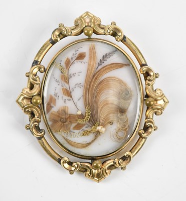 Lot 273 - A Victorian swivel mourning brooch of oval...