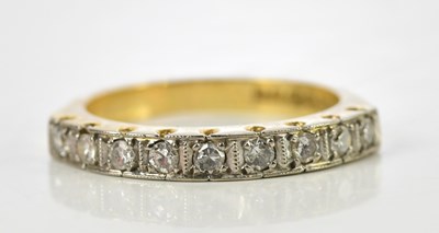 Lot 104 - An 18ct yellow gold nine stone diamond half...