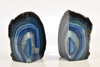 Lot 2302 - A pair of polished blue stone bookends, height...