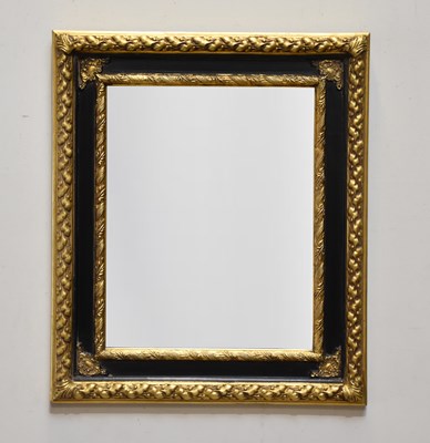 Lot 1022 - A decorative black and gilt framed rectangular...