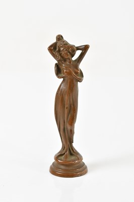 Lot 1557 - An Art Nouveau bronze miniature figure...