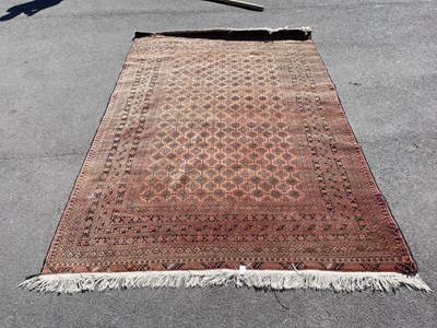 Lot 2520 - A hand knotted red ground Eastern style carpet,...
