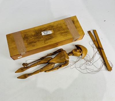Lot 2339 - A mid 20th century wooden puppet, length 44cm,...
