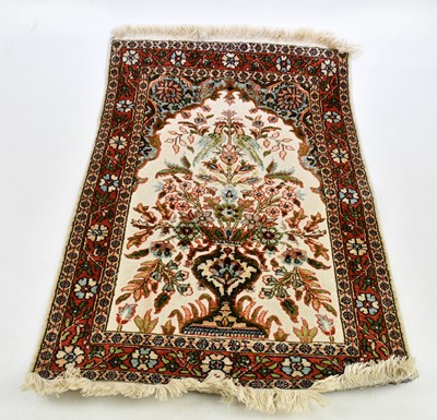 Lot 2518 - A part silk prayer mat, with central geometric...