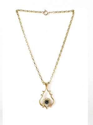 Lot 1078 - A 9ct yellow gold pendant set with a central...