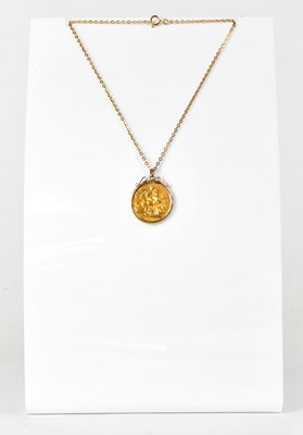 Lot 1081 - A full sovereign 1914, in a 9ct yellow gold...