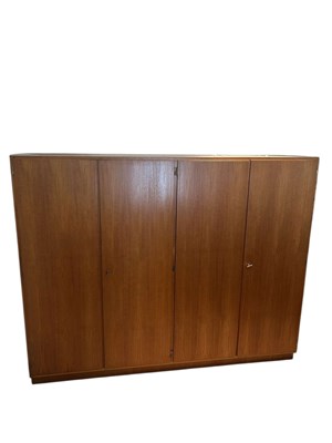 Lot 2010 - A mid century Danish teak four door wardrobe.