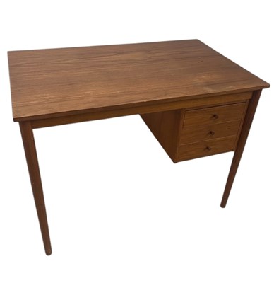 Lot 2023 - A mid century teak desk, the rectangular top...