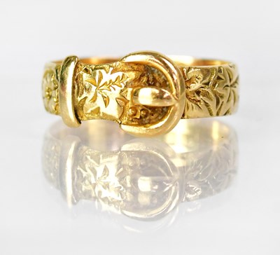 Lot 1034 - An 18ct yellow gold buckle ring with floral...