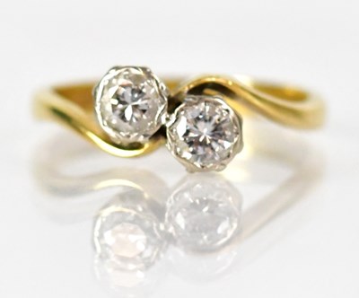 Lot 1024 - An 18ct yellow gold and platinum ring set with...