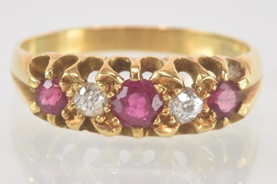 Lot 1149 - An 18ct yellow gold ruby and diamond set five...
