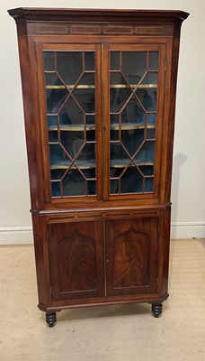 Lot 1160 - A 19th century mahogany freestanding corner...