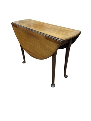Lot 1235 - A 19th century mahogany oval drop-leaf table...