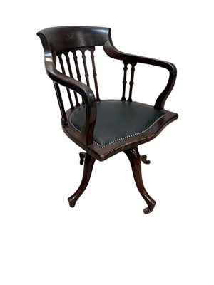 Lot 1242 - An early 20th century mahogany revolving...