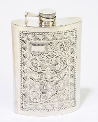 Lot 2413 - An Indian white metal hip flask of curved form...