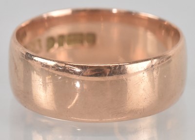 Lot 1169 - A 9ct gold band ring, size U, approx 6g.
