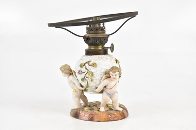 Lot 1572 - A 19th century Continental porcelain oil lamp...