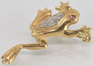 Lot 1280 - A 9ct yellow gold diamond and ruby set brooch...