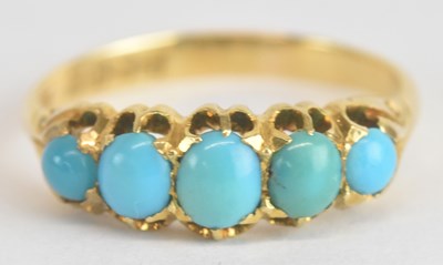 Lot 1154 - An 18ct yellow gold turquoise set five stone...