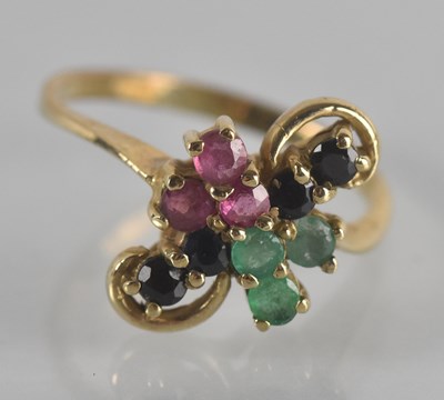 Lot 1164 - A yellow metal emerald, ruby and sapphire set...