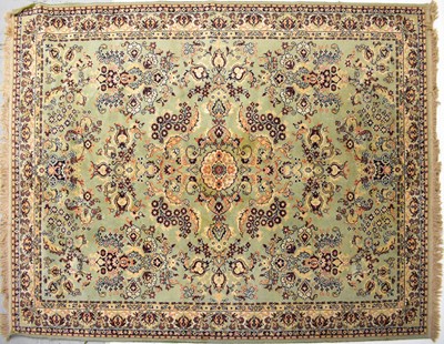 Lot 127 - WILTON; a pale green ground floral wool rug,...