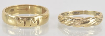 Lot 1172 - Two 9ct gold band rings, both size Q, combined...