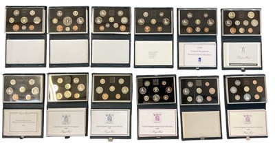 Lot 1465 - ROYAL MINT; twelve cased coin year sets from...