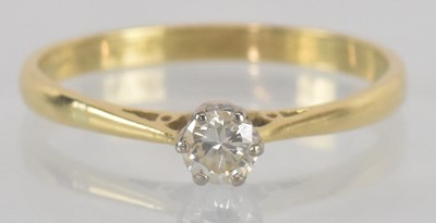 Lot 1155 - A gold diamond solitaire ring, the claw set...