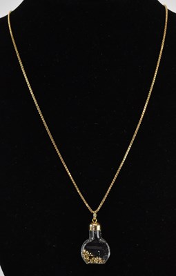Lot 1202 - A necklace pendant in the form of a glass...