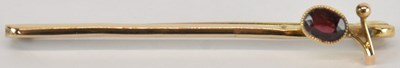 Lot 1287 - A 9ct gold bar brooch set with a cut amethyst...