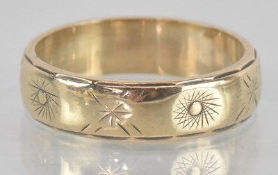 Lot 1181 - A 9ct gold band ring, size J, approx 3g.