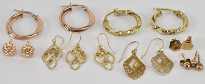 Lot 1098 - Seven pairs of gold earrings including a pair...