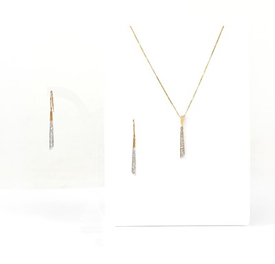 Lot 1077 - A 9ct yellow and white gold pendant set with...