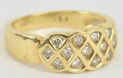 Lot 1110 - An 18ct yellow gold diamond ring, set with...