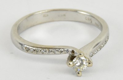 Lot 1119 - A 14ct white gold diamond solitaire ring, with...