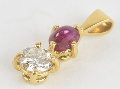 Lot 1192 - A yellow metal ruby and diamond set drop...
