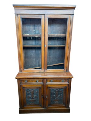 Lot 2141 - A late Victorian walnut bookcase with pair of...