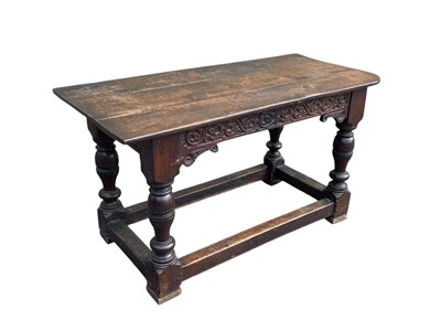 Lot 2131 - An antique oak table with altered top on...