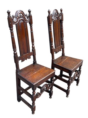 Lot 2057 - A pair of 18th century oak hall chairs with...