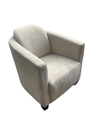 Lot 2043 - A modern suede upholstered armchair.