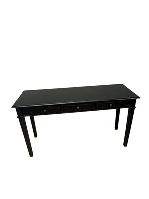 Lot 2044 - A modern ebonised three drawer hall table,...