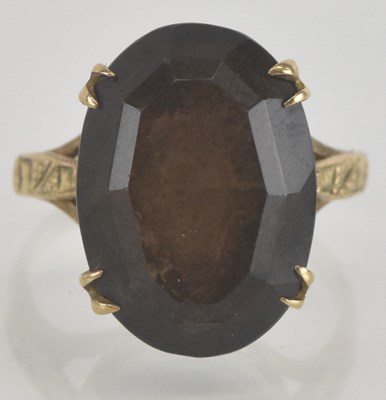 Lot 1180 - A 9ct gold dress ring, with a large marquise...