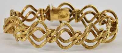 Lot 1299 - A 9ct gold contemporary bracelet, with...