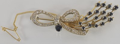 Lot 1262 - An 18ct gold diamond and sapphire floral...