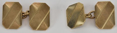 Lot 1261 - A pair of 9ct gold cufflinks united by a short...