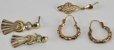 Lot 1345 - Two pairs of gold coloured metal earrings and...