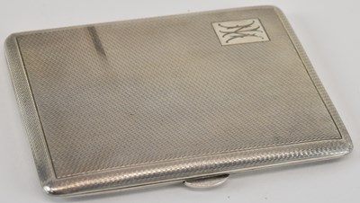 Lot 1087 - A large hallmarked silver cigarette case, with...